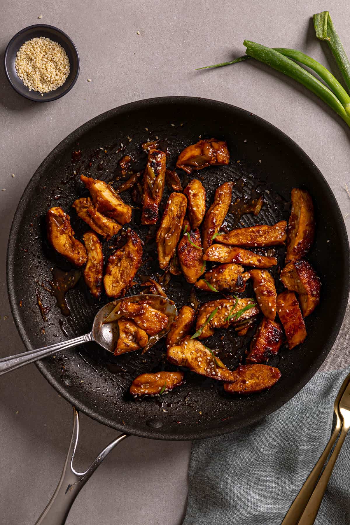 Honey ginger chicken in a nonstick skillet.