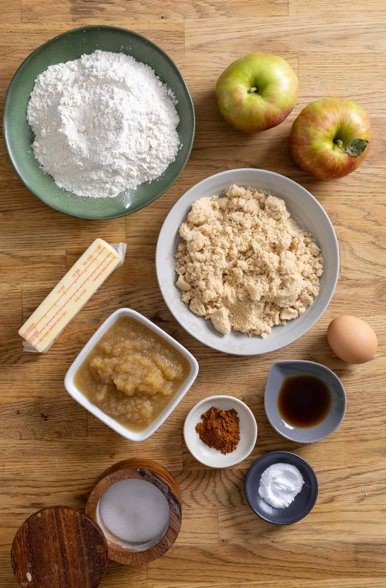 Ingredients for applesauce crumb cake on a butcherblock countertop.