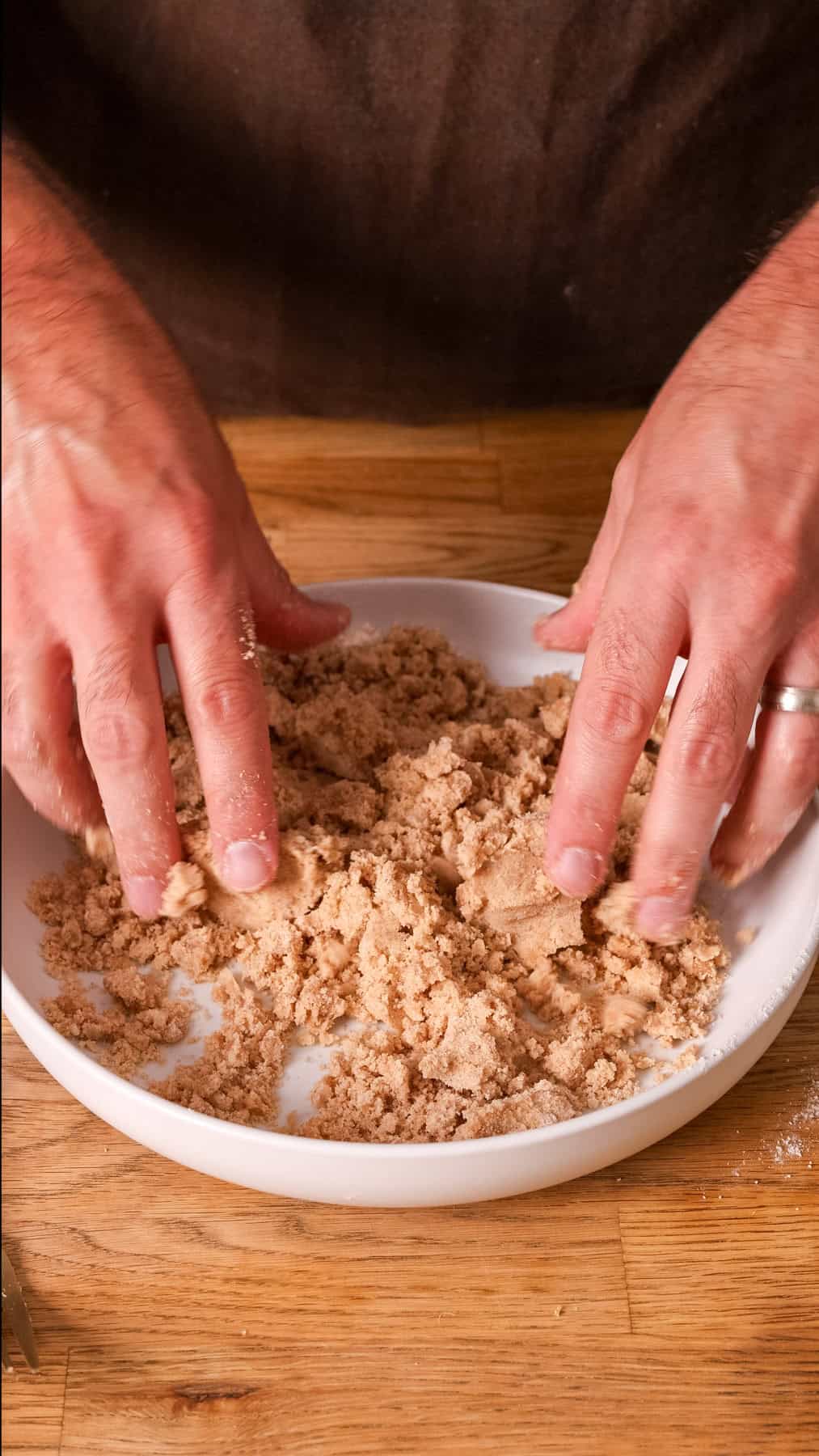 Crumb topping for a coffee cake in a mixing bowl.