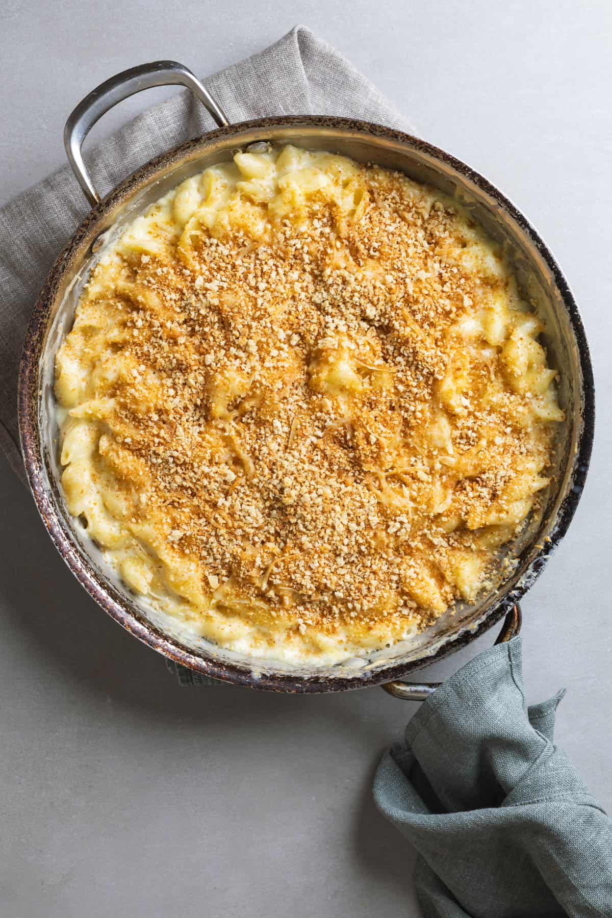 Gouda mac and cheese in a skillet fresh out of the oven.